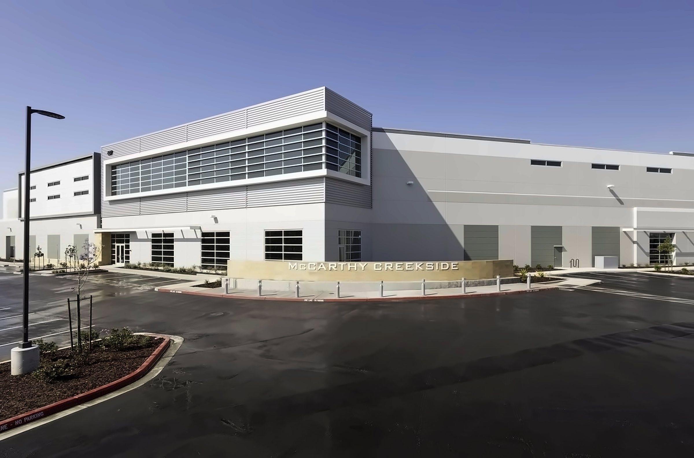 Concrete industrial building with a glass office front